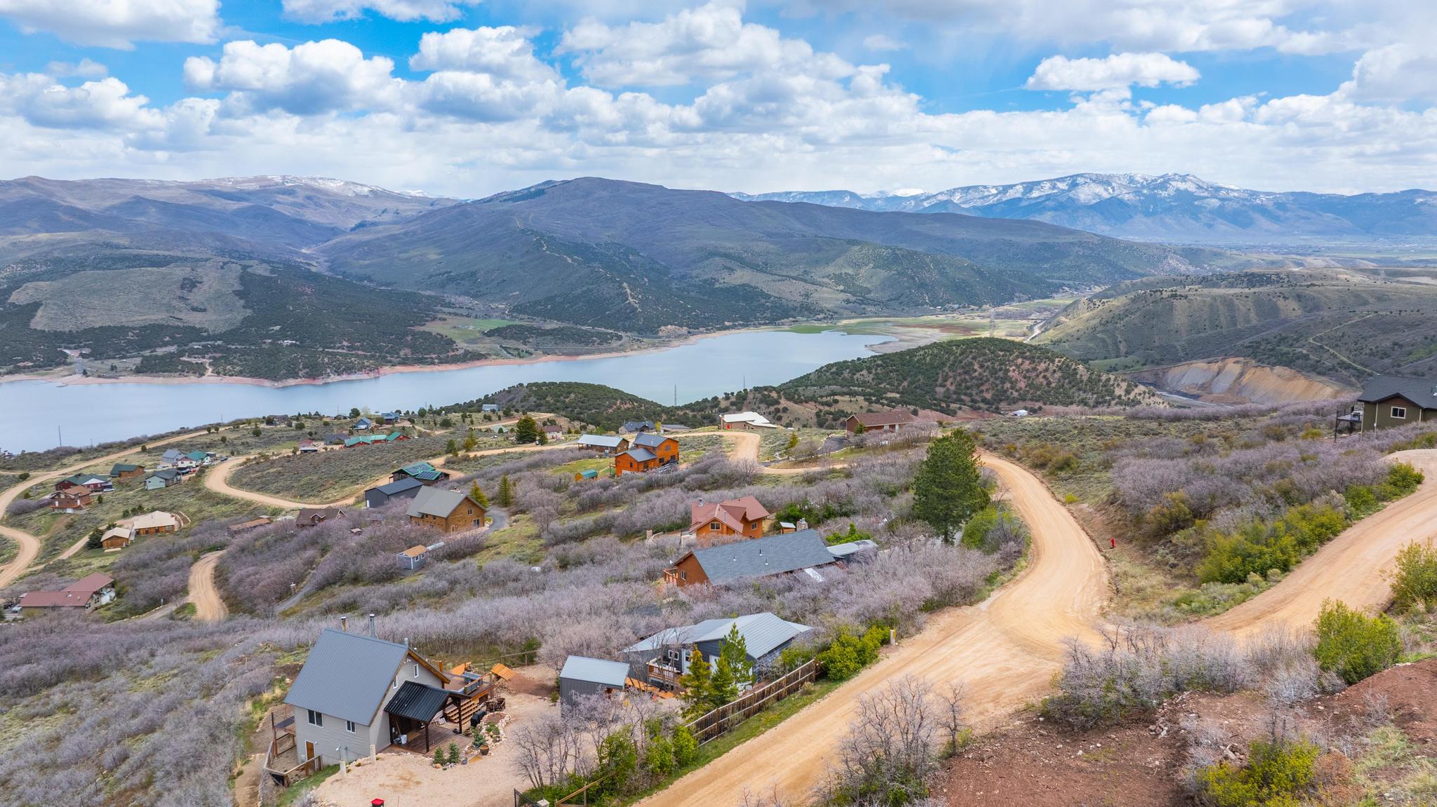View of mountain backdrop featuring a large body of water