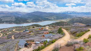 View of mountain backdrop featuring a large body of water