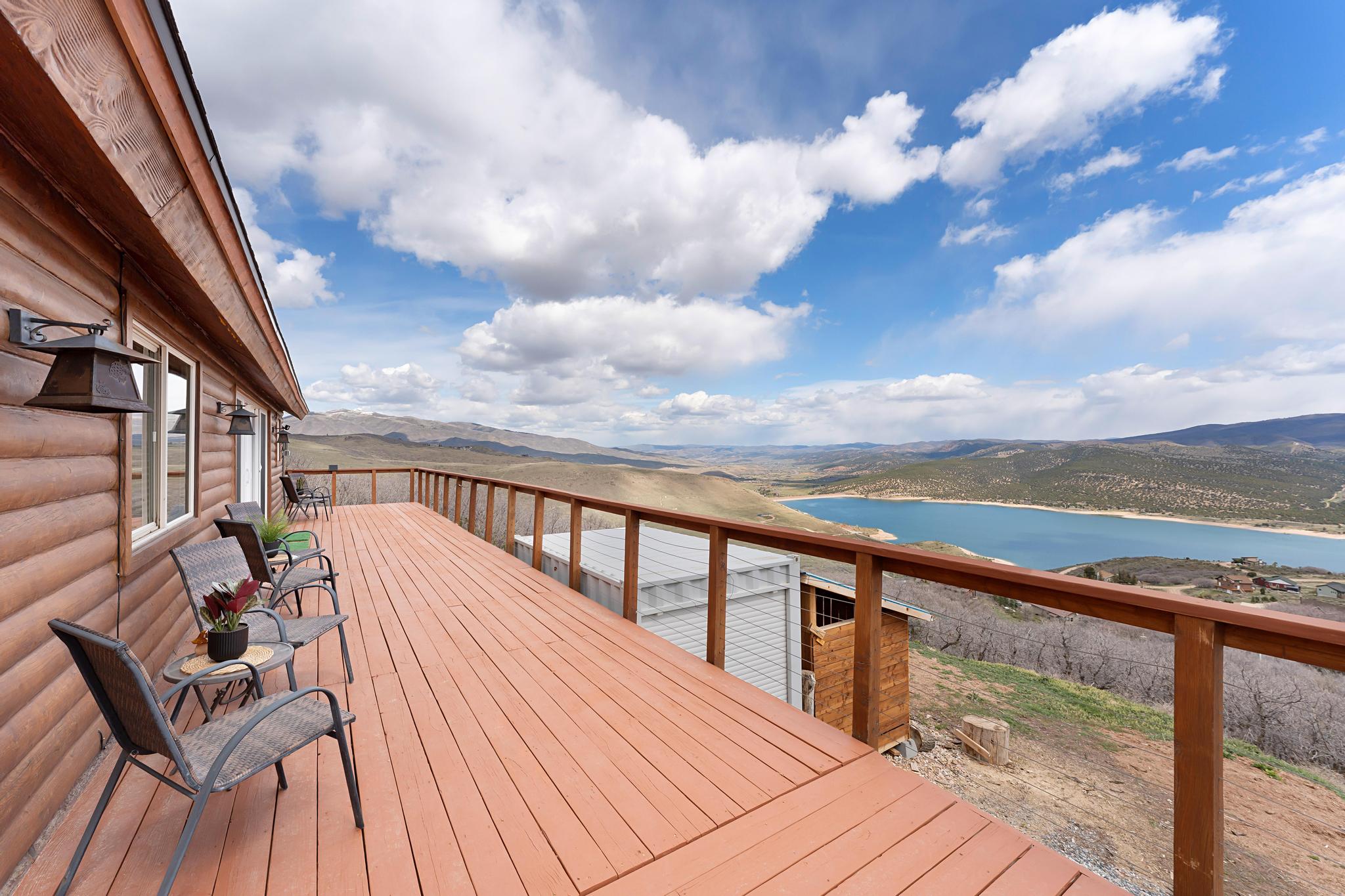 Deck featuring a water and mountain view