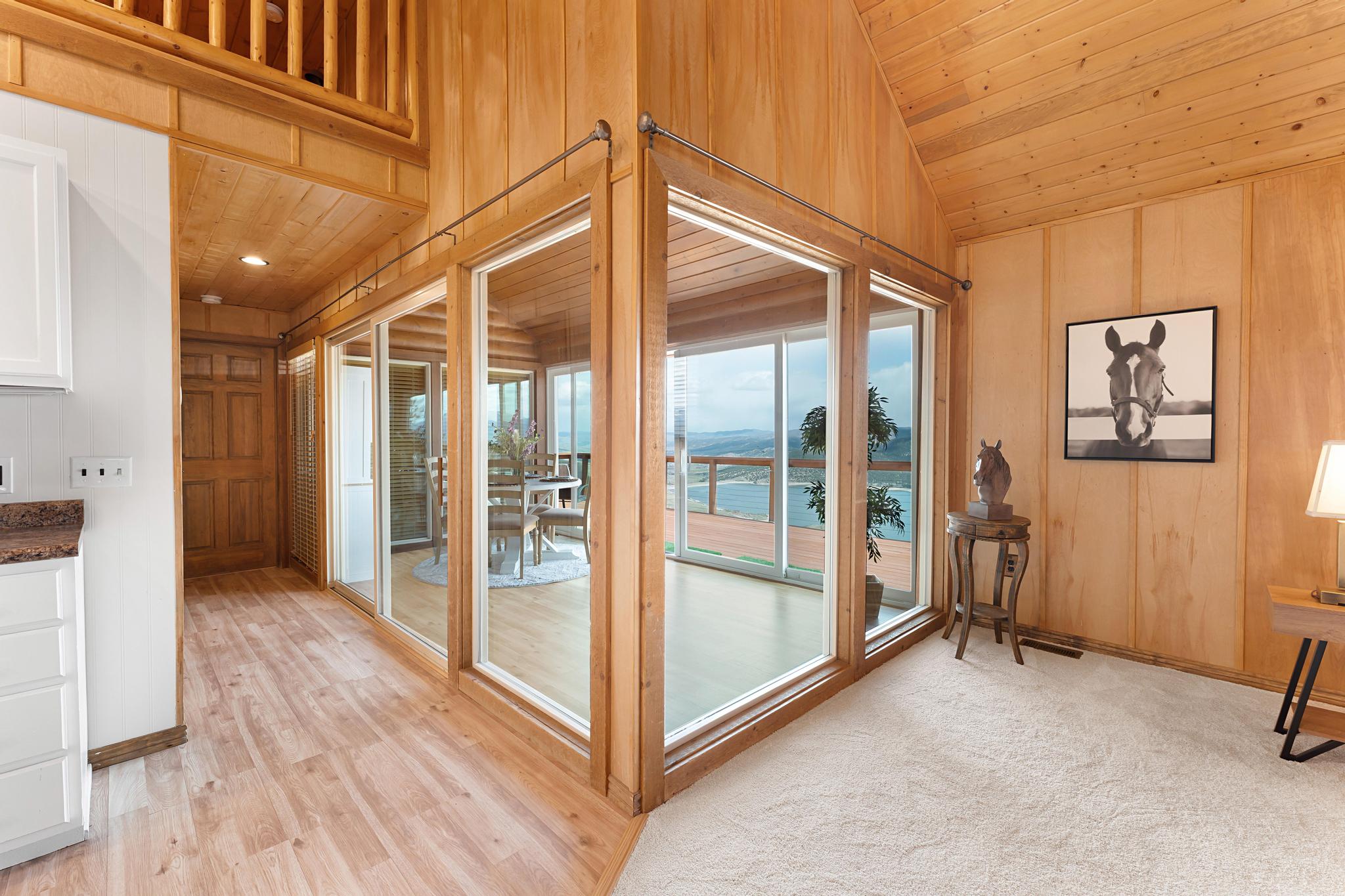 Entryway with a vaulted wooden ceiling and wood walls