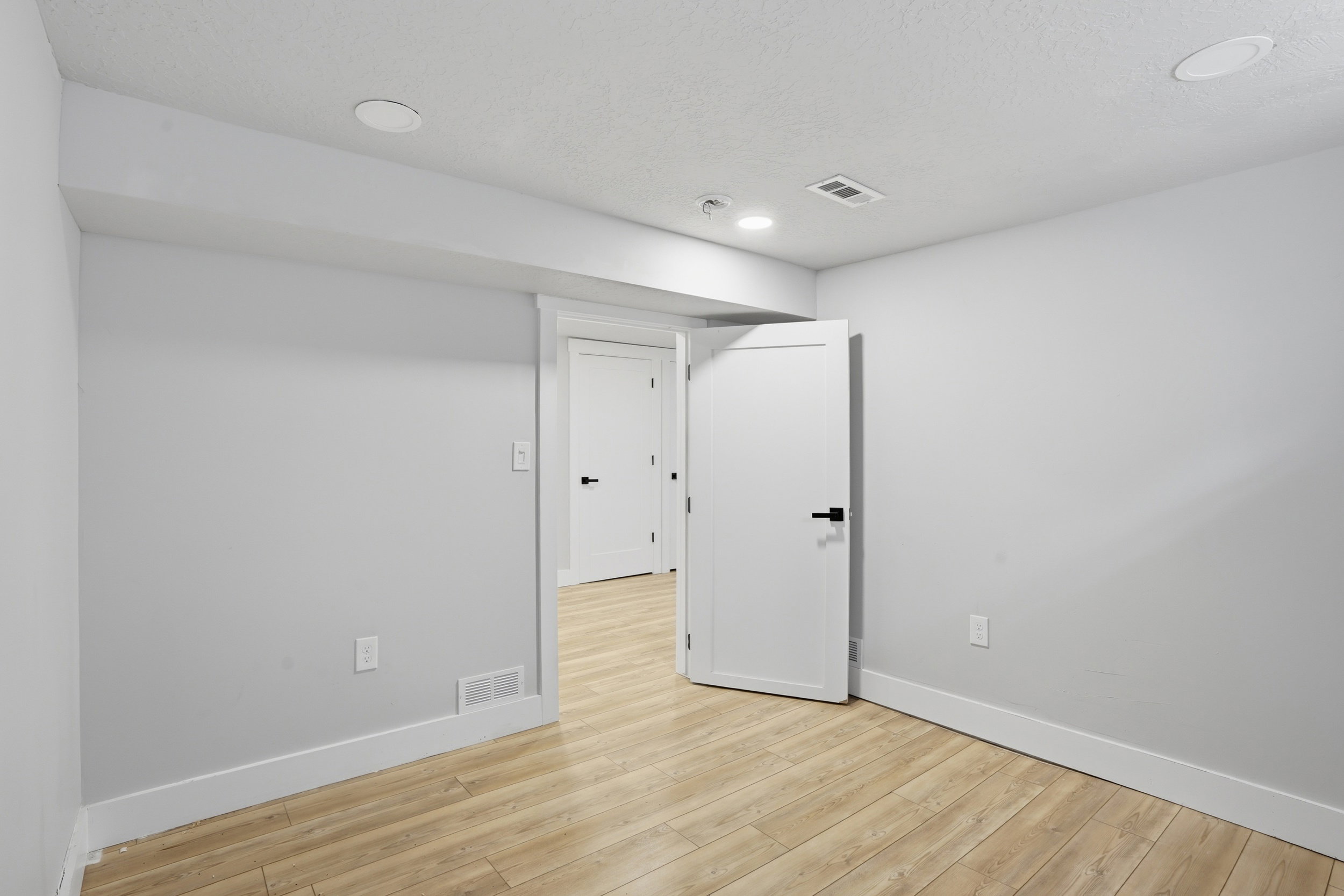 Unit #40 studio apartment with separate entrance. Unfurnished room with light wood finished floors and recessed lighting