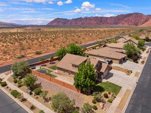 Aerial perspective of suburban area with mountains and a desert landscape