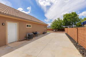 Fenced backyard featuring a patio area
