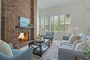 Carpeted living room featuring a fireplace