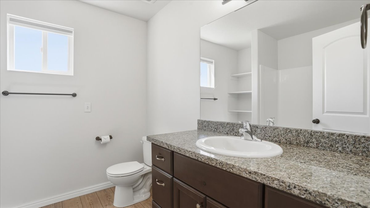 Bathroom with vanity and light wood finished floors