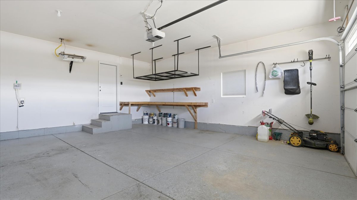 Garage featuring a garage door opener