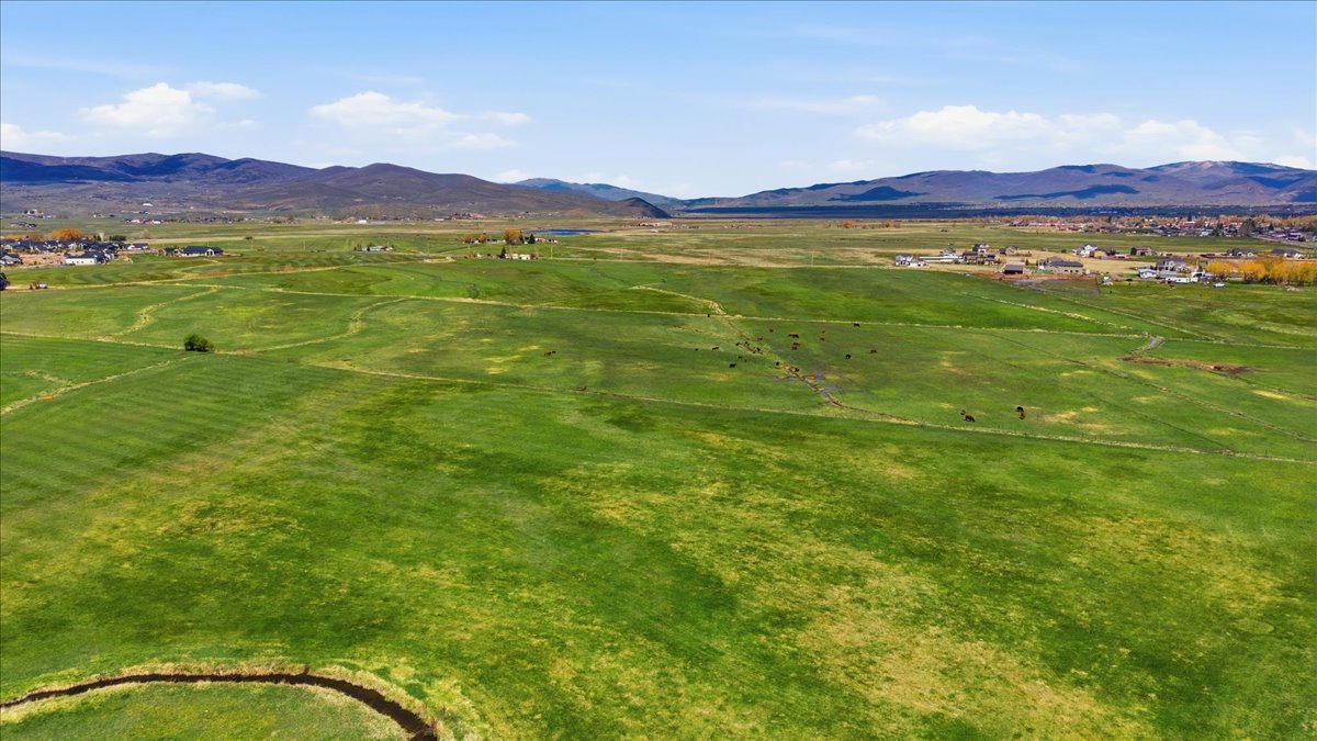 View of mountain background featuring rural landscape