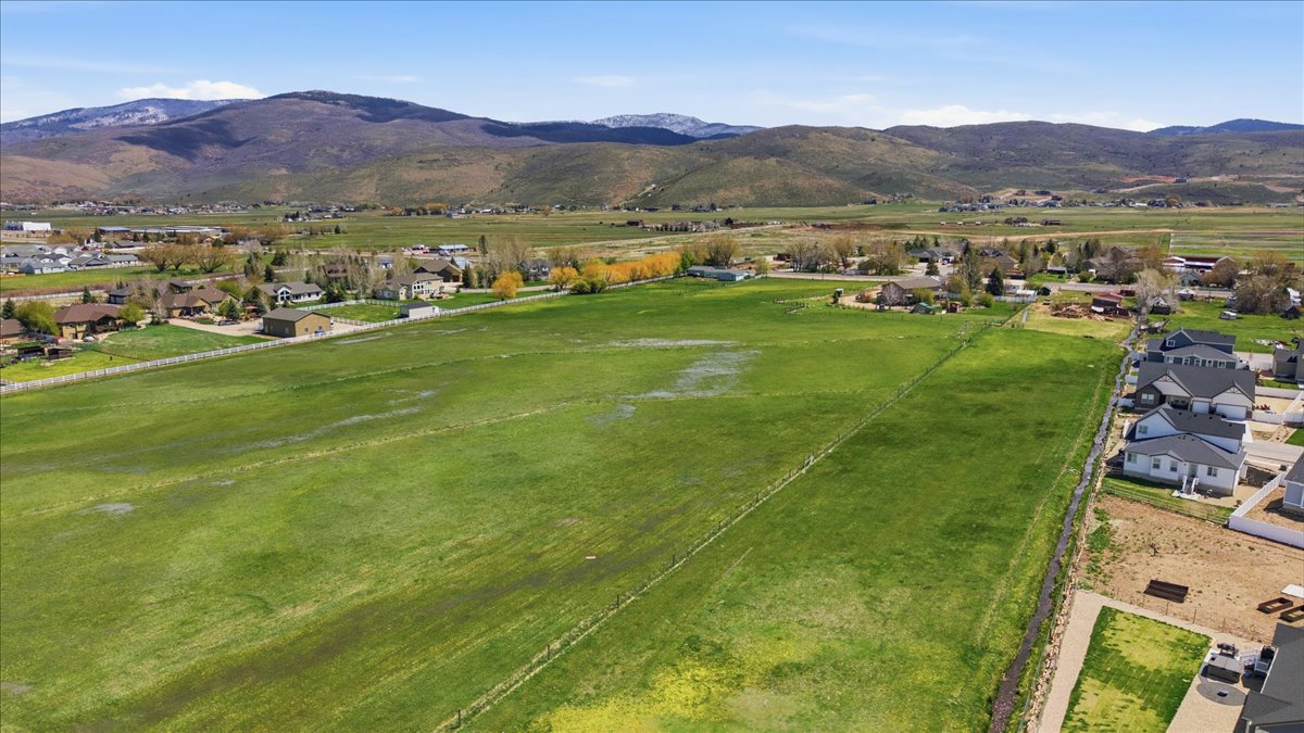 View of property location with nearby suburban area and mountains