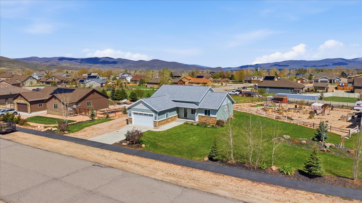 Aerial perspective of suburban area with a mountain backdrop