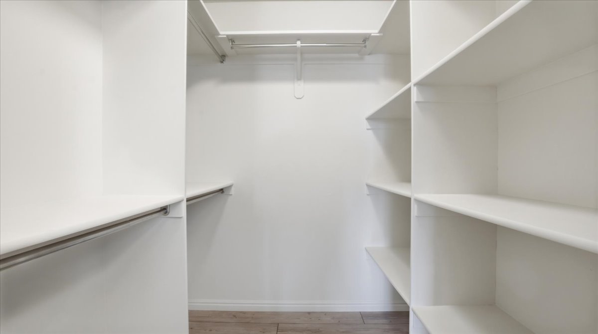 Walk in closet featuring light wood-style floors