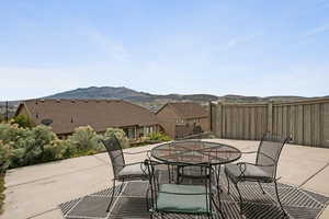 View of patio / terrace with outdoor dining area and a mountain view