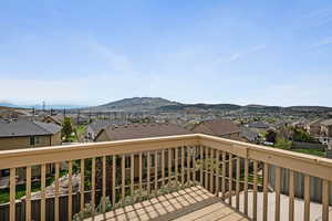 Wooden deck featuring a mountain view and a residential view