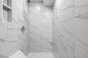 Bathroom featuring tiled shower