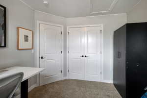 Unfurnished office featuring light colored carpet