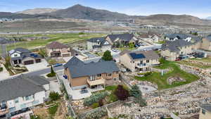 Aerial perspective of suburban area with a mountain backdrop