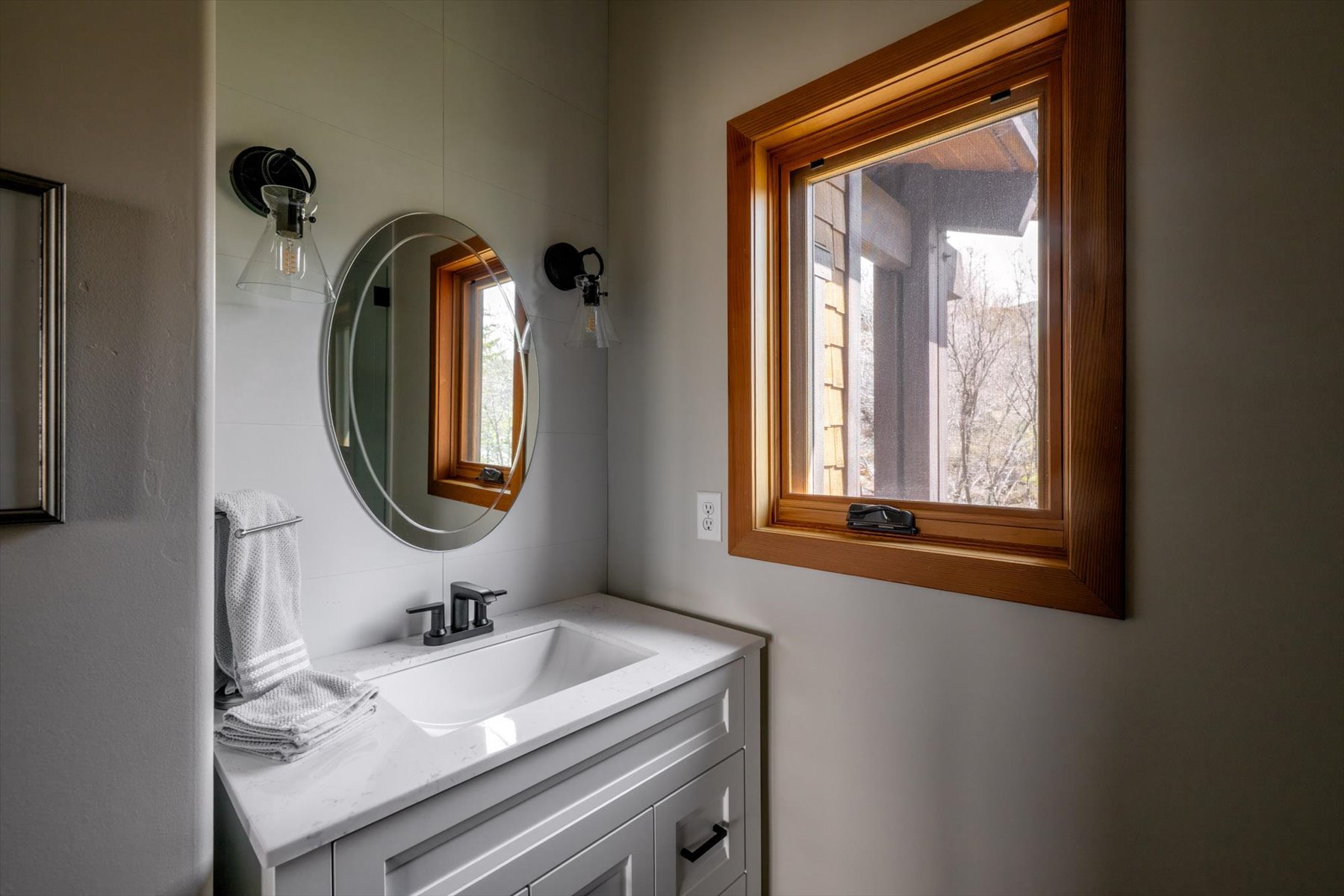 Bathroom with vanity and healthy amount of natural light