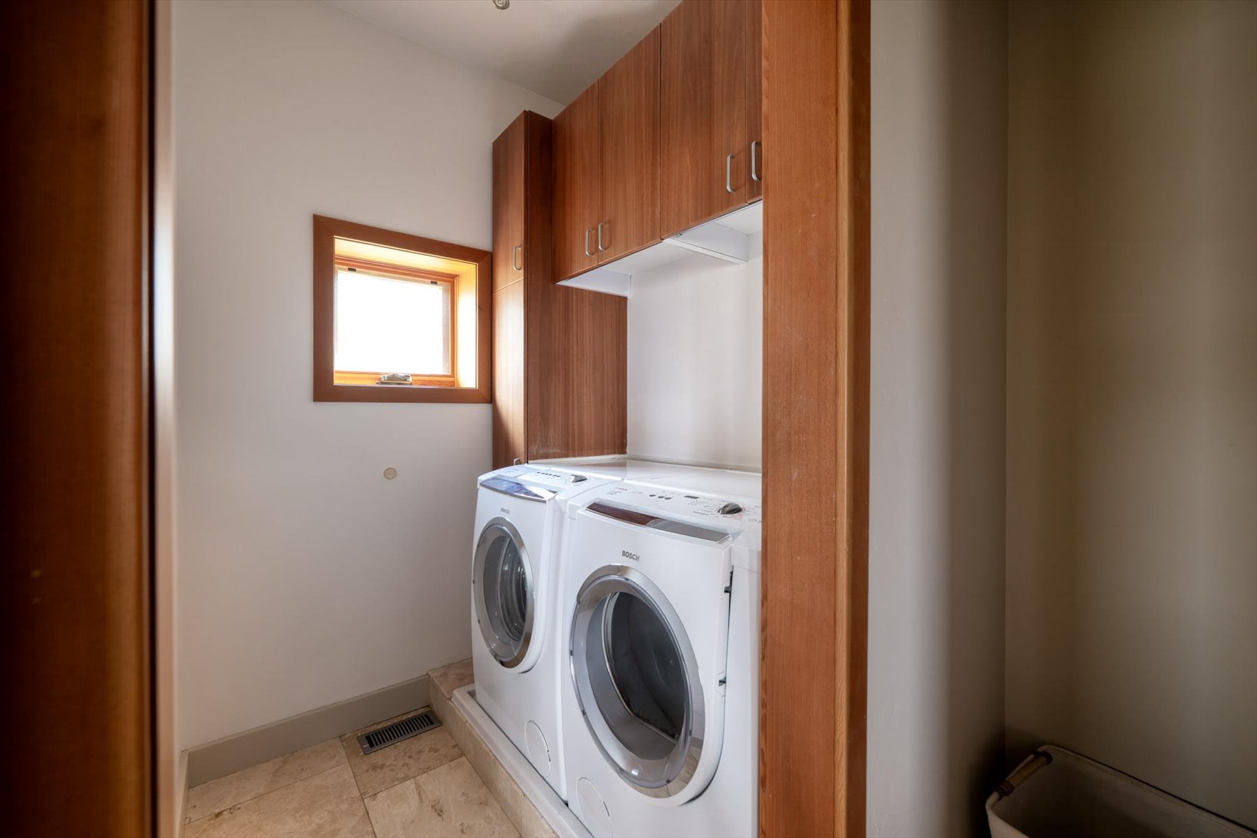 Laundry area with cabinet space and washer and clothes dryer