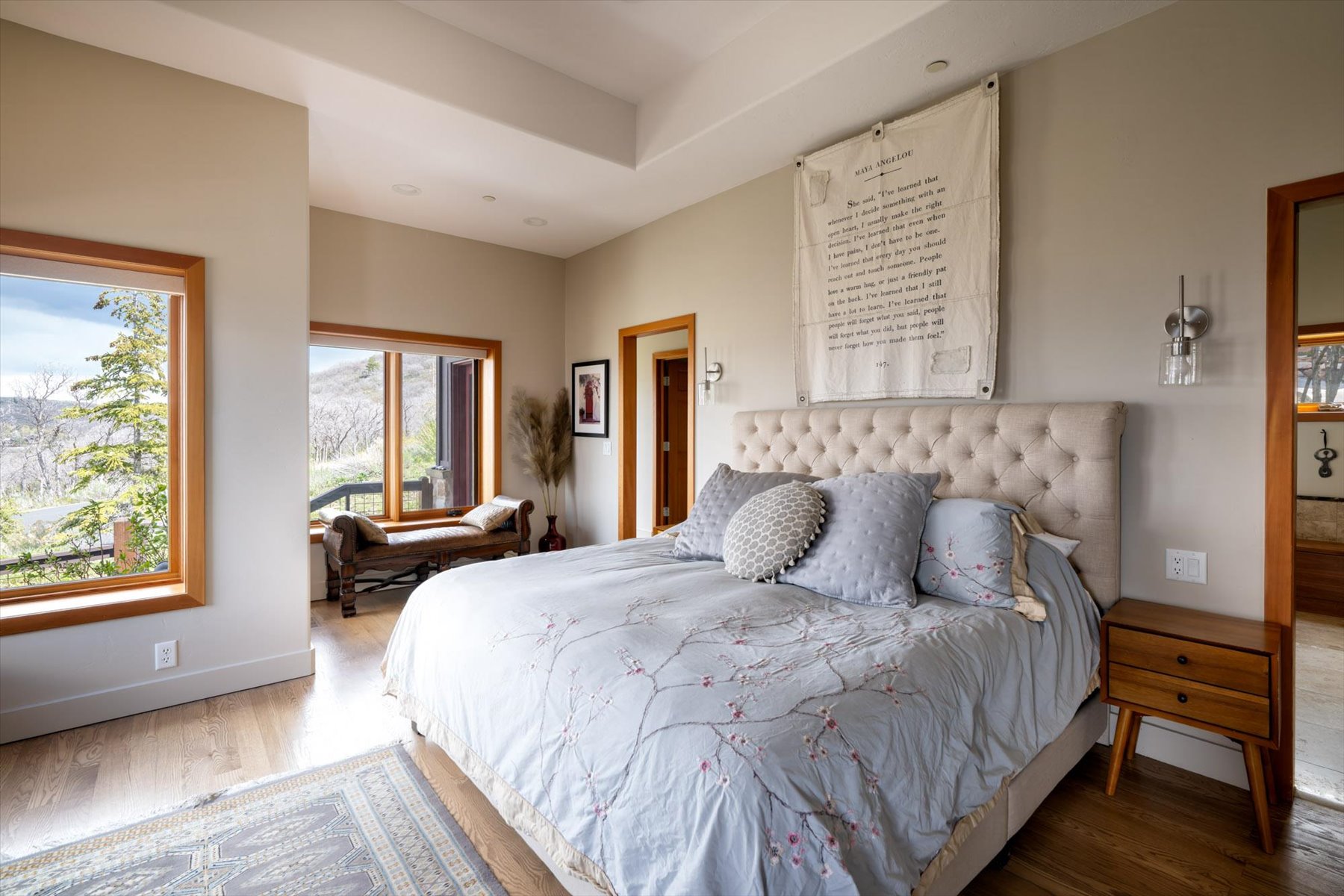 Bedroom featuring wood finished floors and baseboards