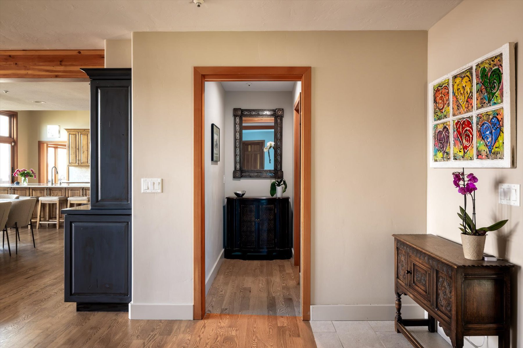 Corridor with light wood-type flooring and baseboards