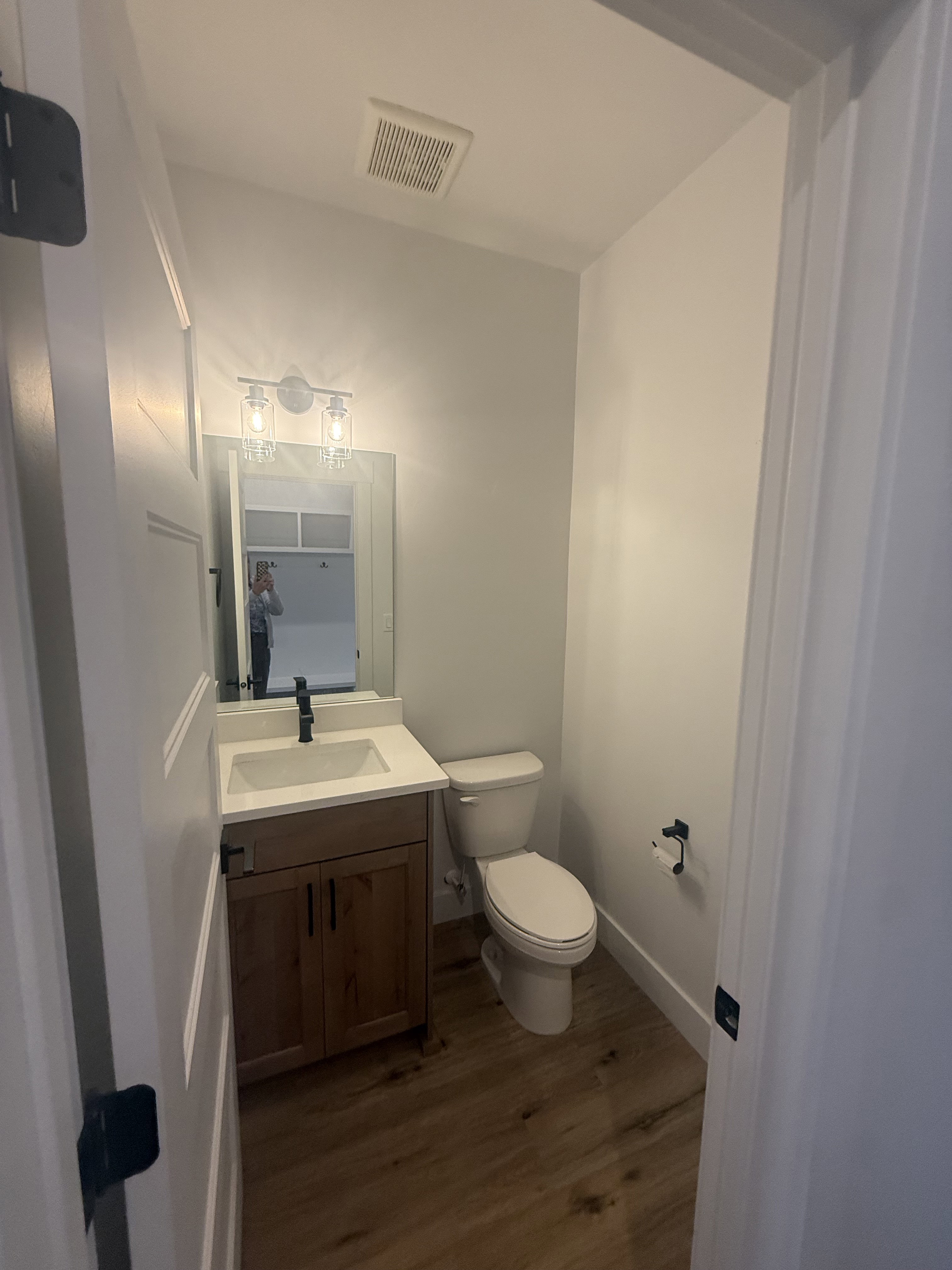 Bathroom with vanity and dark wood-style floors