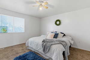 Bedroom with carpet floors and a ceiling fan