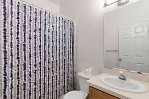 Bathroom featuring vanity and a shower with curtain
