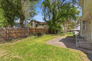 Fenced backyard with a patio area