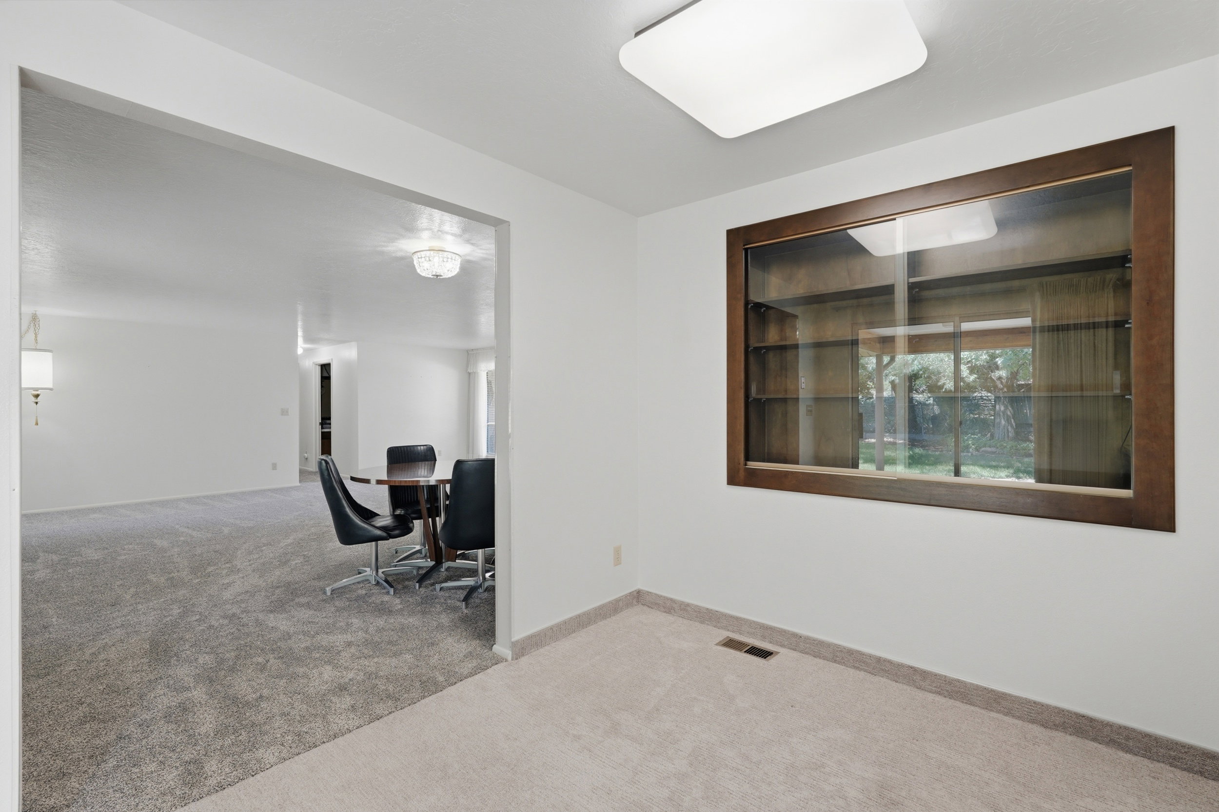 Built-in display cabinet with wood-finish frame