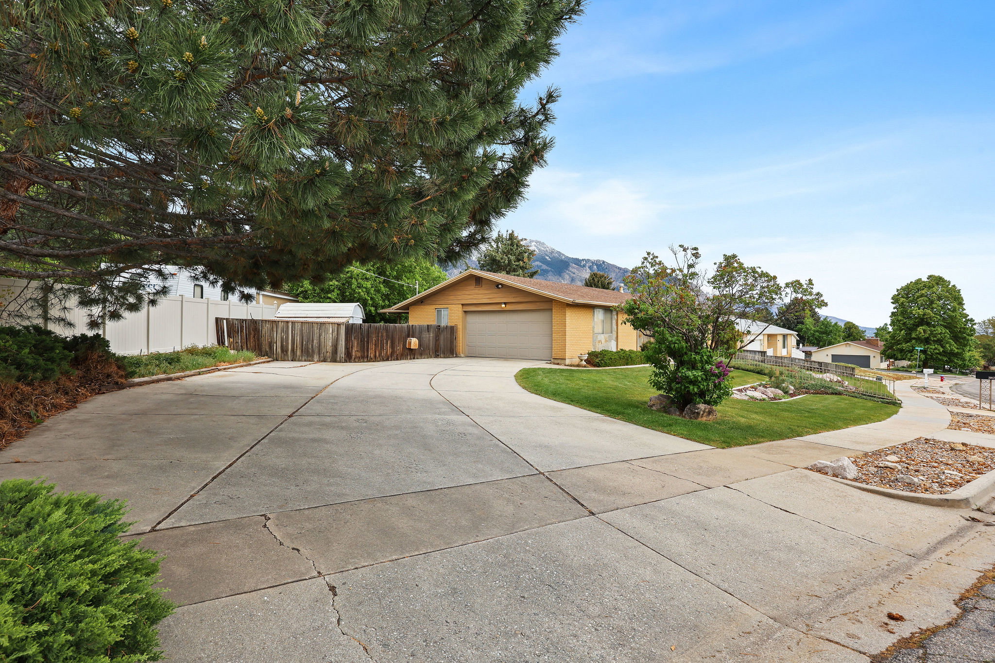 View of garage with RV and extra parking.