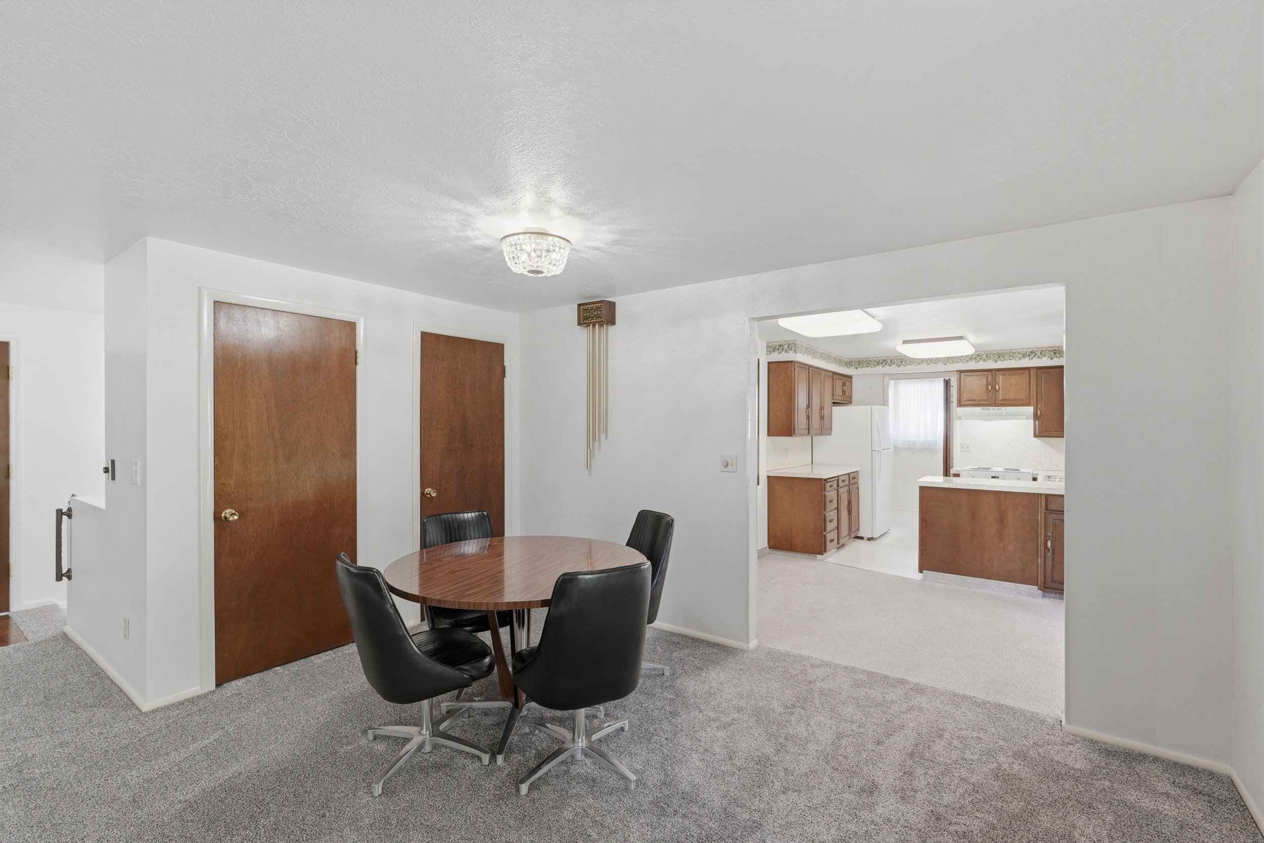 Dining area featuring a crystal light fixture