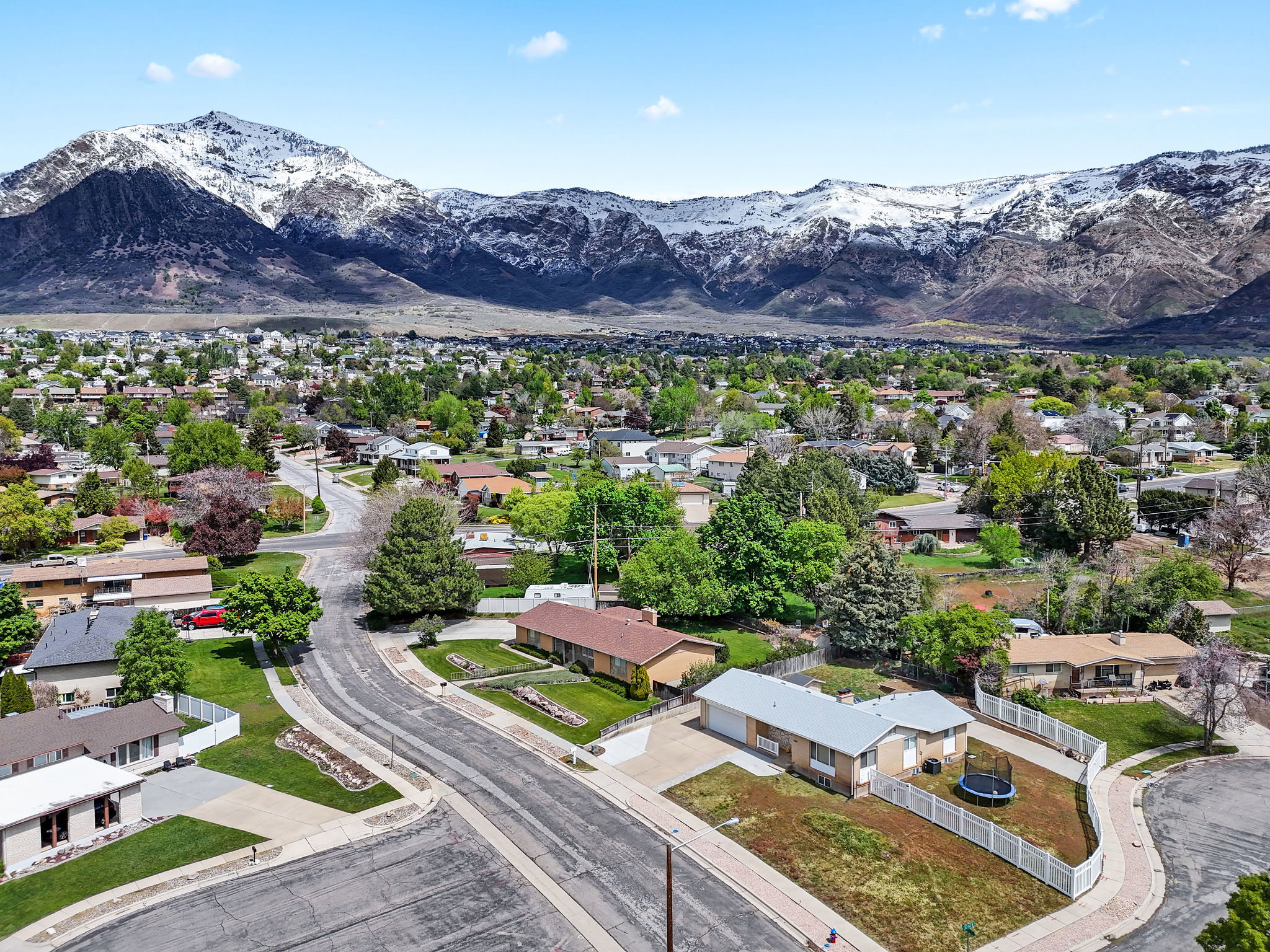 Aerial view of residential area featuring a mountain backdrop