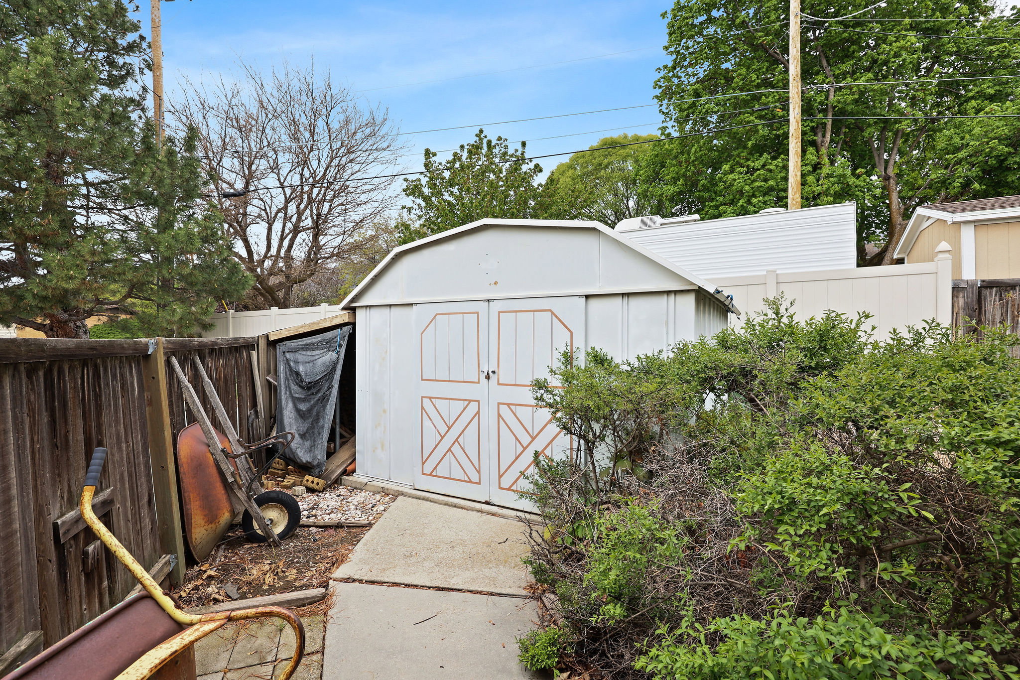 View of shed with a fenced backyard