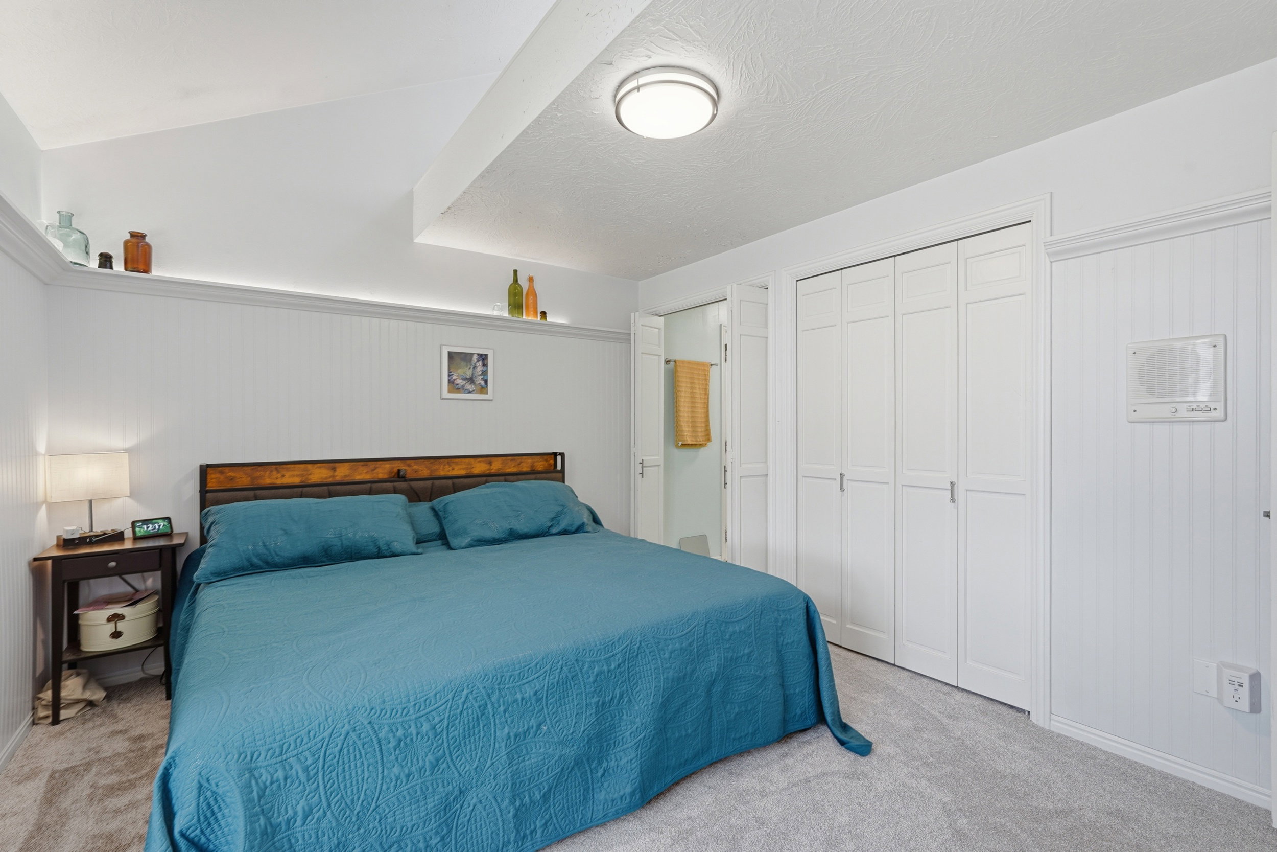 Bedroom with lofted ceiling, and ensuite bathroom