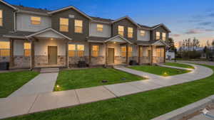 This is not the exact unit. All units have the same style and finishes throughout. Photo has been AI generated to add grass