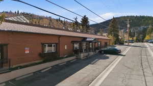 View of building exterior with uncovered parking
