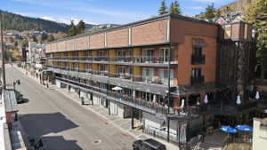 View of apartment building / complex featuring a mountain view
