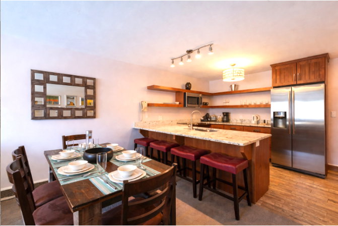 Dining room featuring light wood-type flooring and track lighting