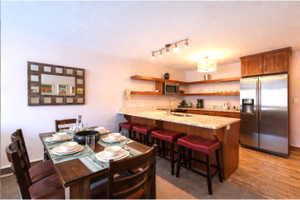 Dining room featuring light wood-type flooring and track lighting