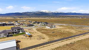 Aerial perspective of suburban area featuring a mountain backdrop