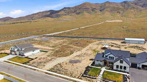 Aerial view of sparsely populated area featuring a mountainous background