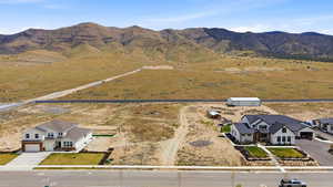 Overview of rural landscape featuring a mountain backdrop