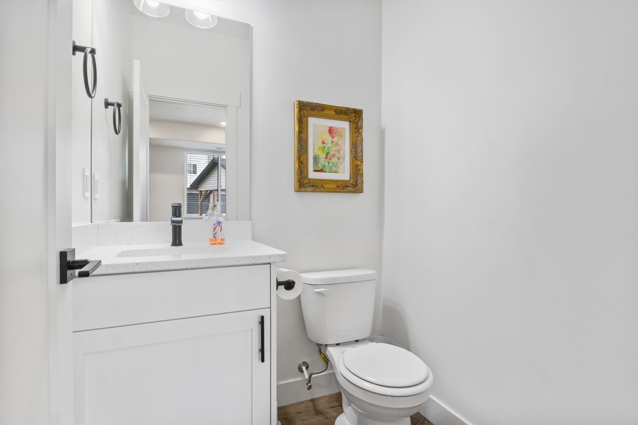 Bathroom featuring vanity and wood finished floors