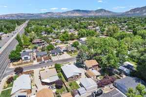 Residential neighborhood featuring a prominent multi-lane thoroughfare and distant mountain range