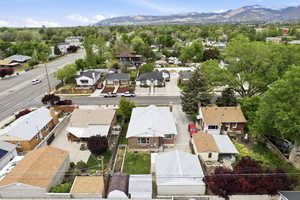 Aerial perspective of suburban area with a mountainous background
