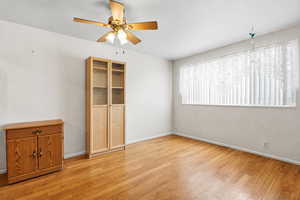Spare room featuring ceiling fan and light wood finished floors