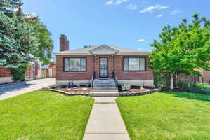 Brick exterior featuring a gabled entry