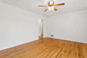 Spare room featuring light wood finished floors and a ceiling fan