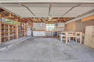 Garage with a workshop area and concrete block wall