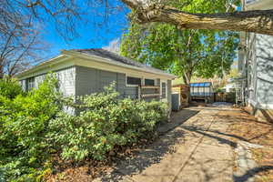 View of side of property featuring an outbuilding