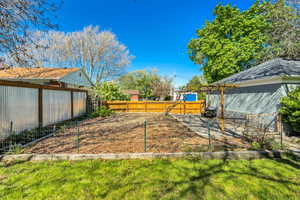 View of fenced backyard